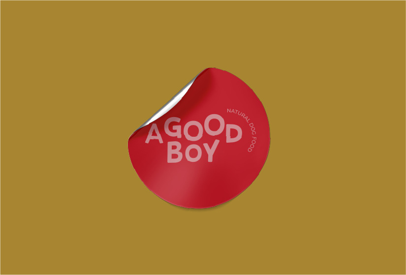 yellow image with a red circular sticker with a pink a good boy logo in the middle