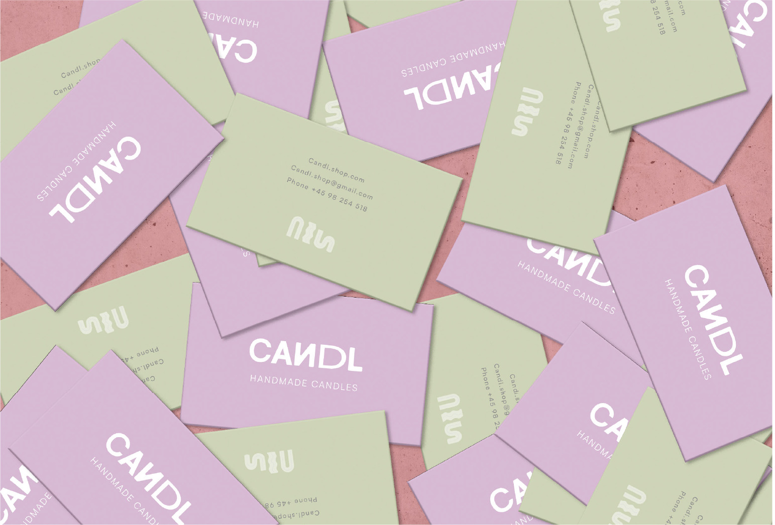 image of green and purple business cards with candl logo in the center