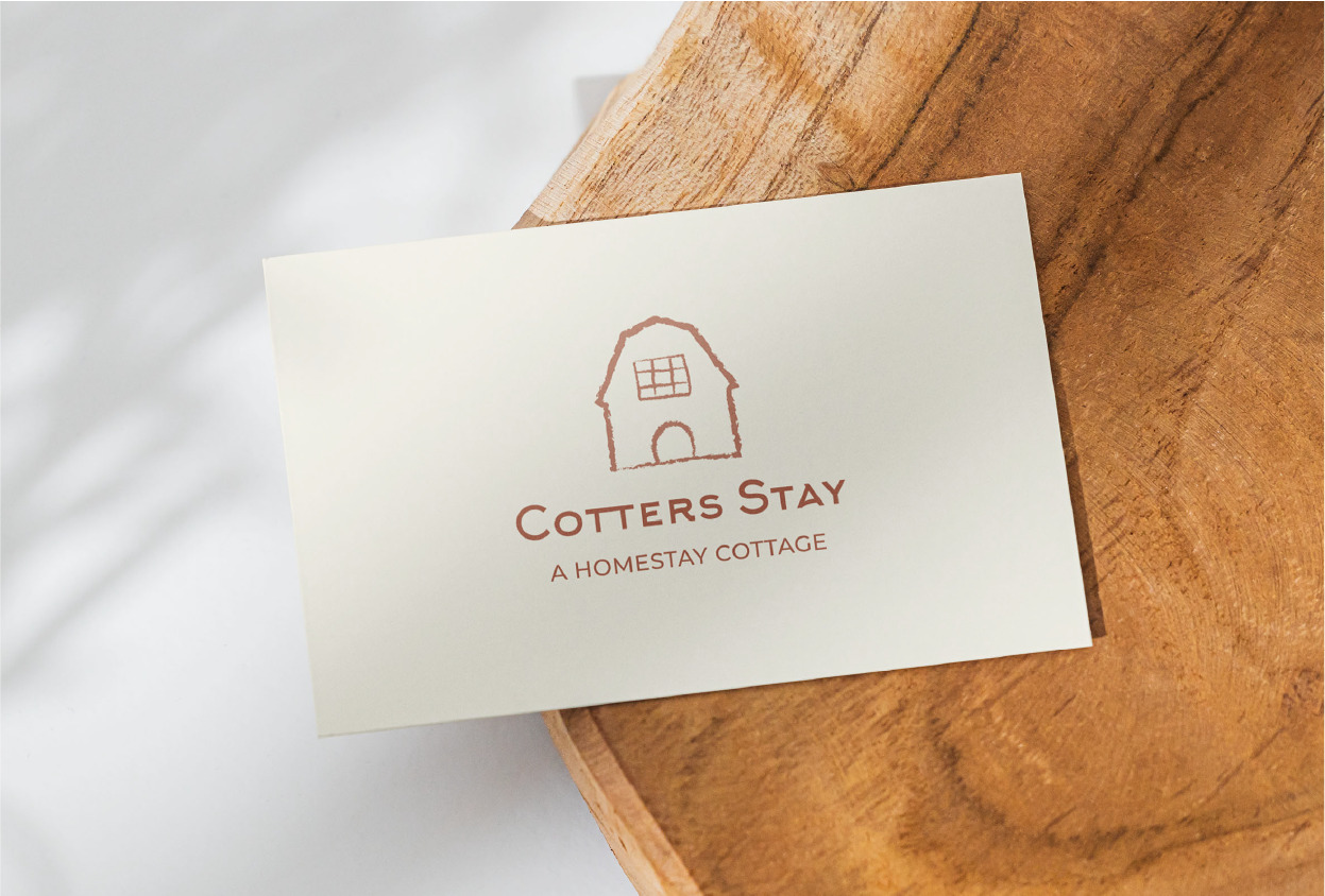 white card with Cotter Stay logo in the center